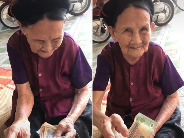  Bà vẫn luôn dành tờ tiền to nhất cho đứa cháu đi học xa nhà. (Ảnh: Ngọc Thiện/VNO)